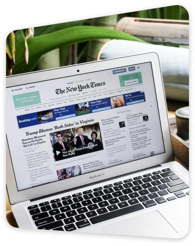 Laptop displaying an article about ISO compliance insights and best practices for businesses