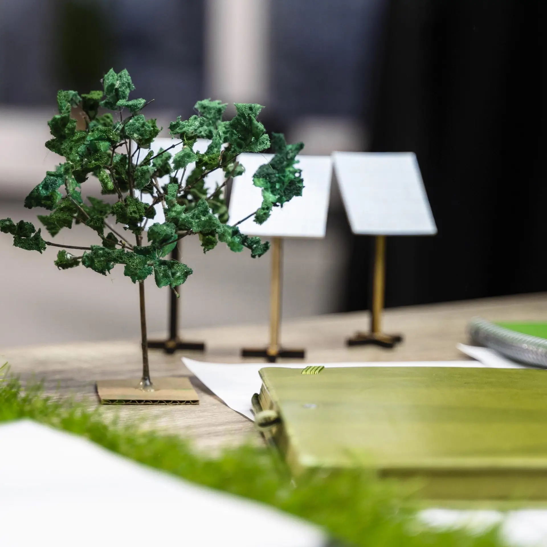 Miniature models representing sustainability planning and environmental strategy